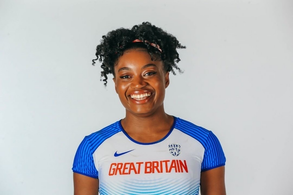 olympic athlete naomi ogbetta smiling into a camera